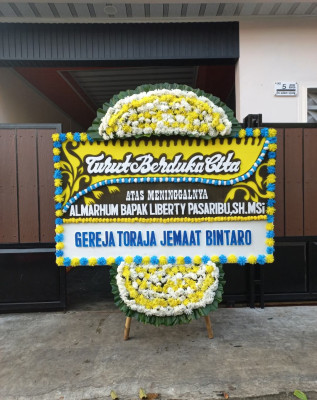 Papan Bunga Duka di Piyaman